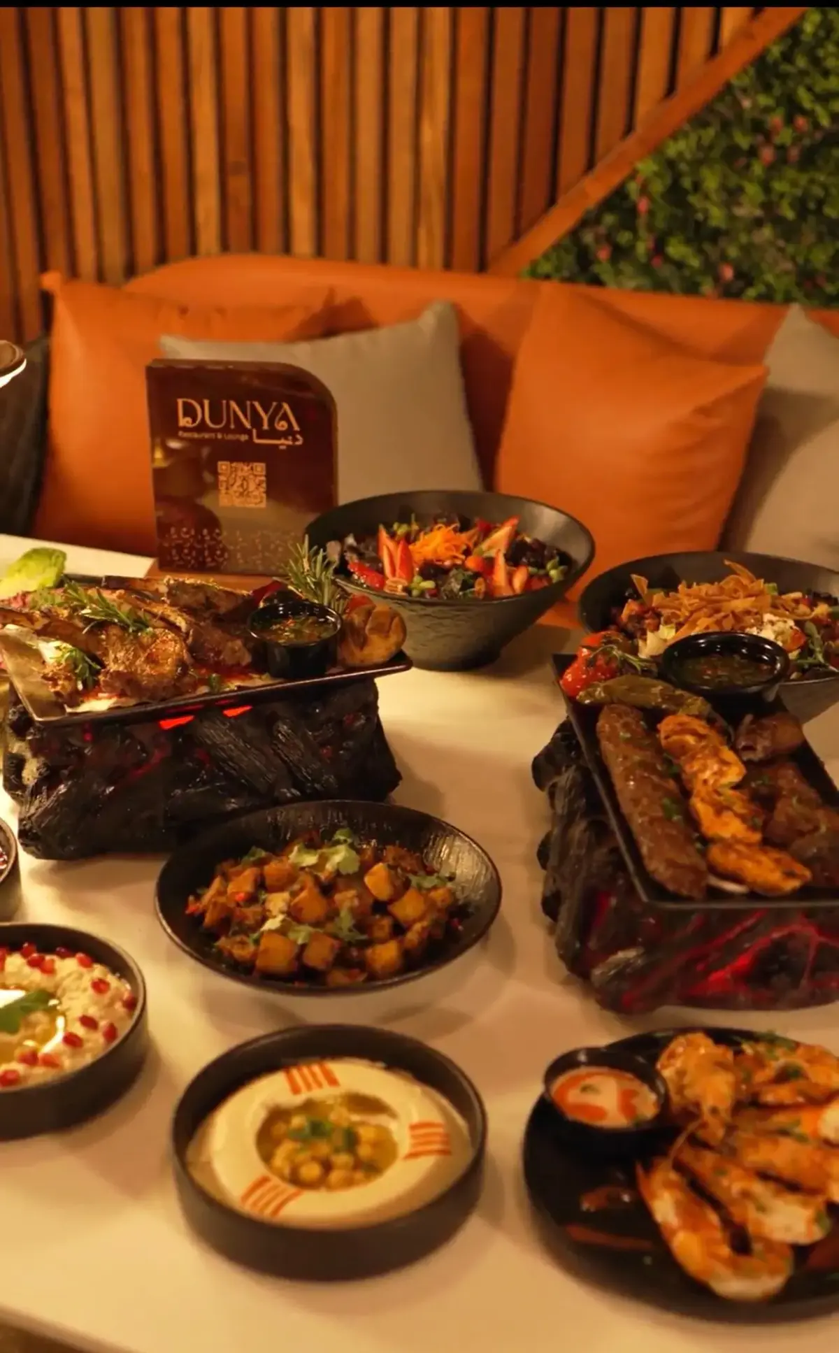 Dunya Lounge full mezze and grilled meat spread with branded table stand