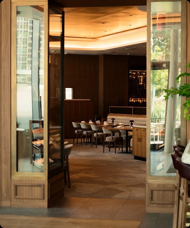 Dunya Lounge dining area with warm ambient lighting and gold accents