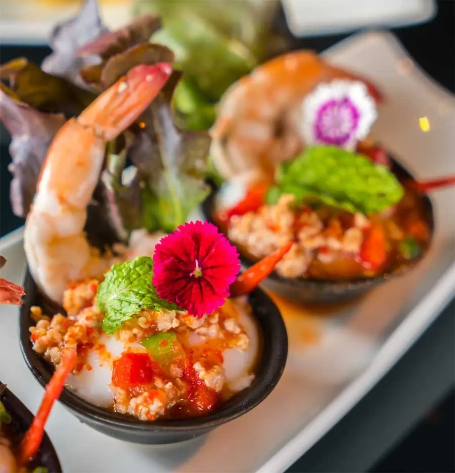 Grilled prawns with Dunya dynamite sauce and fresh herbs